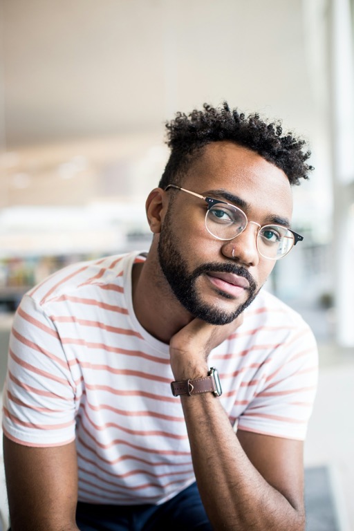 Man with glasses looking at the camera